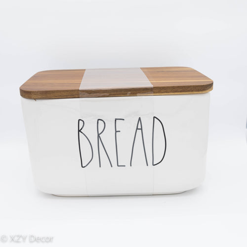 White ceramic box with word “Bread” on the side by artisan designer Rae Dunn.